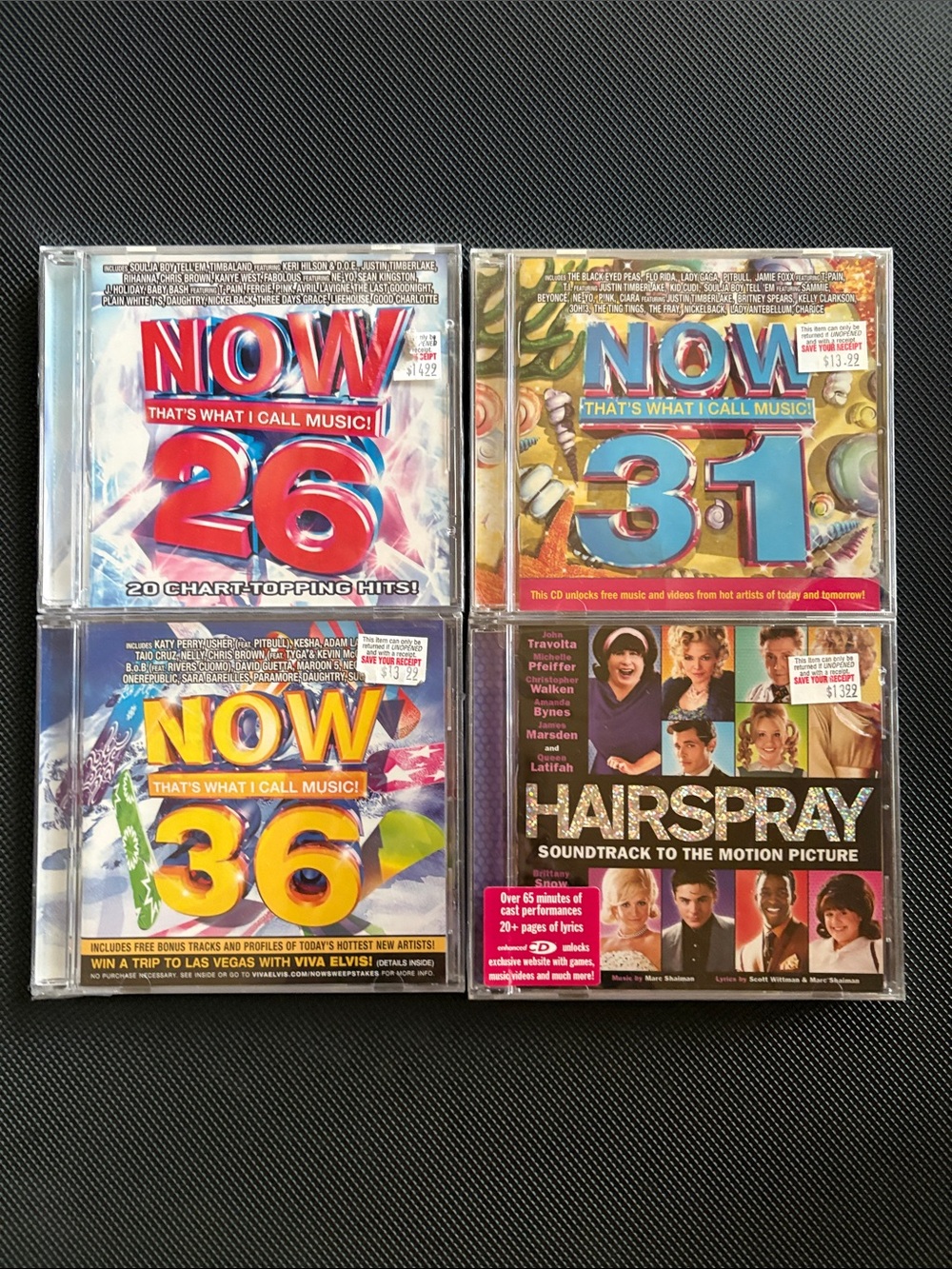 Misc CDs - 3 of the NOW series & soundtrack of Hairspray. Brand new & unopened